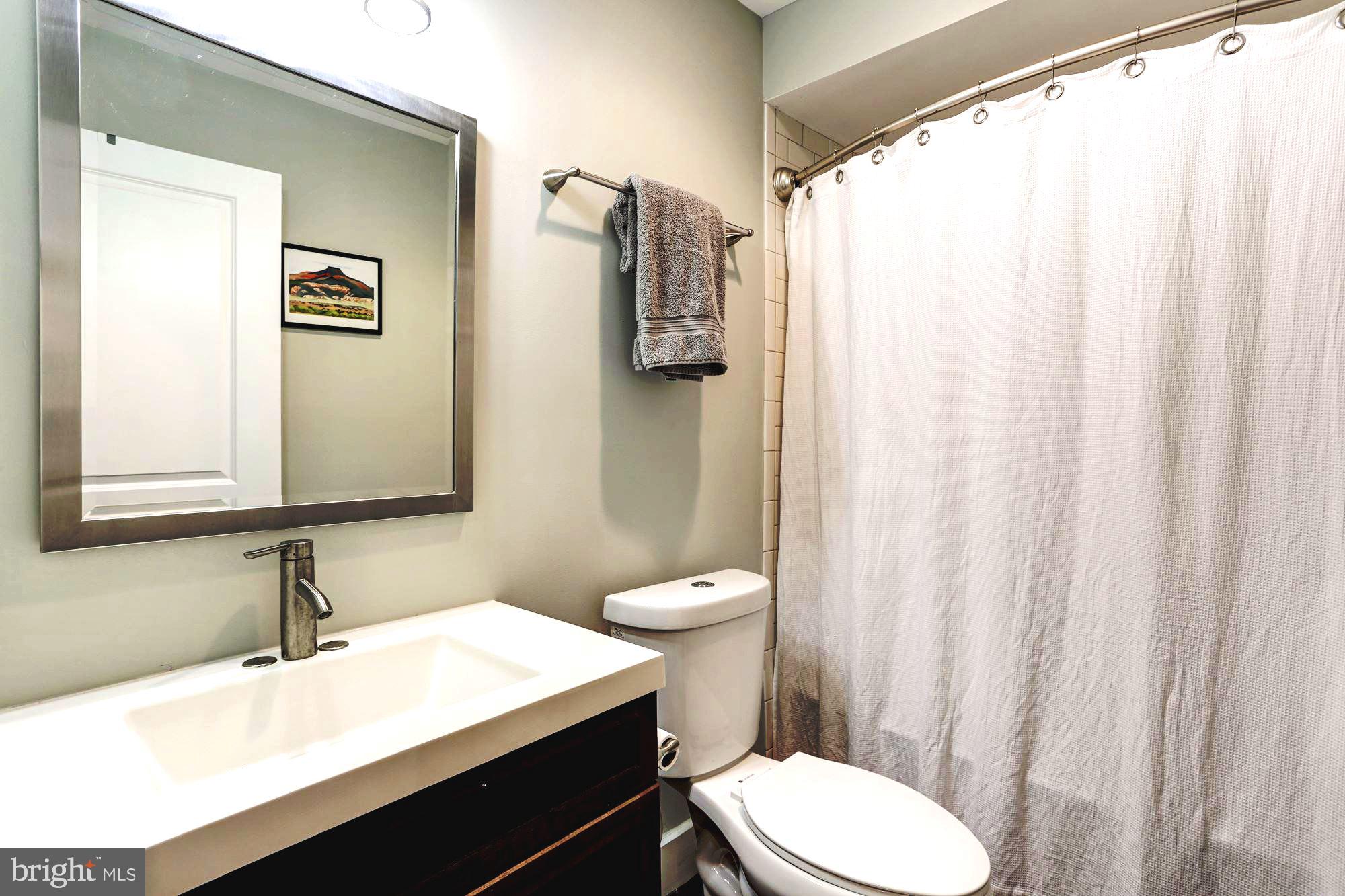 16 R Street Northwest, Unit 1 Washington, DC 20001 - Photo 14 of 22 Full baths next to bedrooms #1 & #2