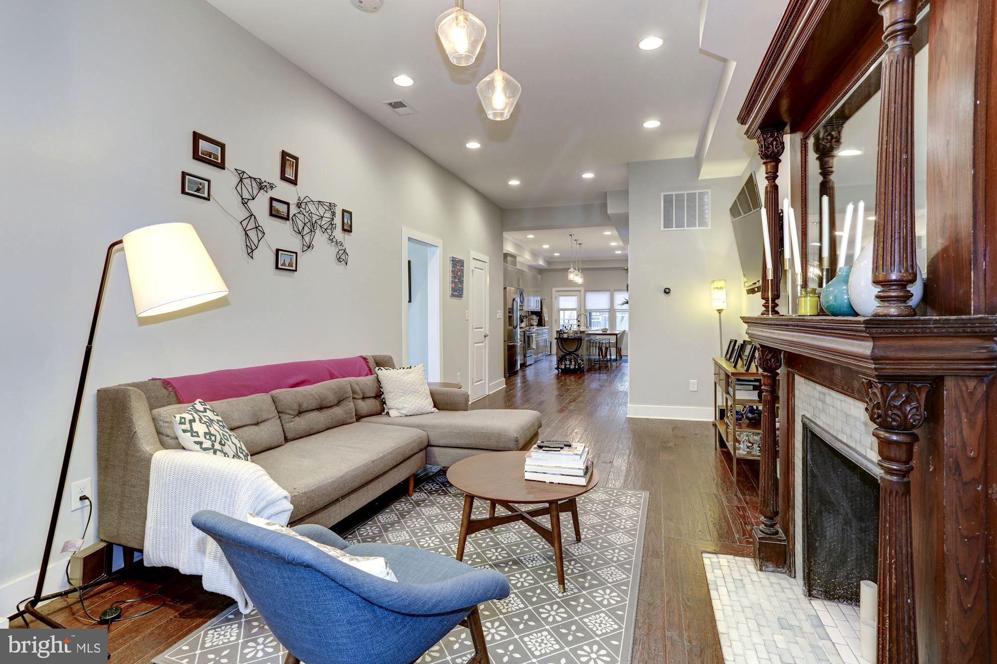 16 R Street Northwest, Unit 1 Washington, DC 20001 - Photo 2 of 22 The stunning fireplace and mantle is a centerpiece