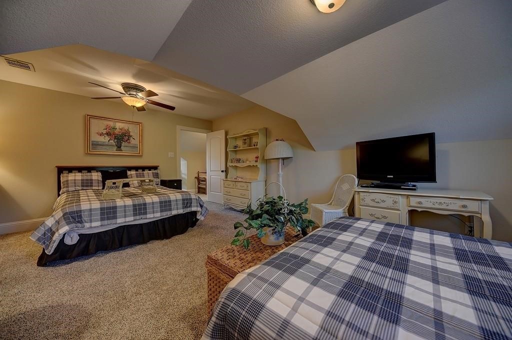 8456 Schuster Road Ledbetter, TX 78946 - Photo 30 of 49 a bedroom with furniture and a flat screen tv