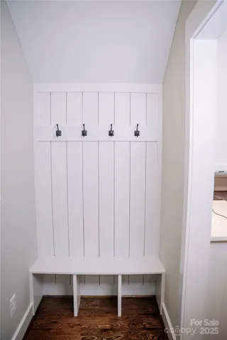 a view of room with wooden floor