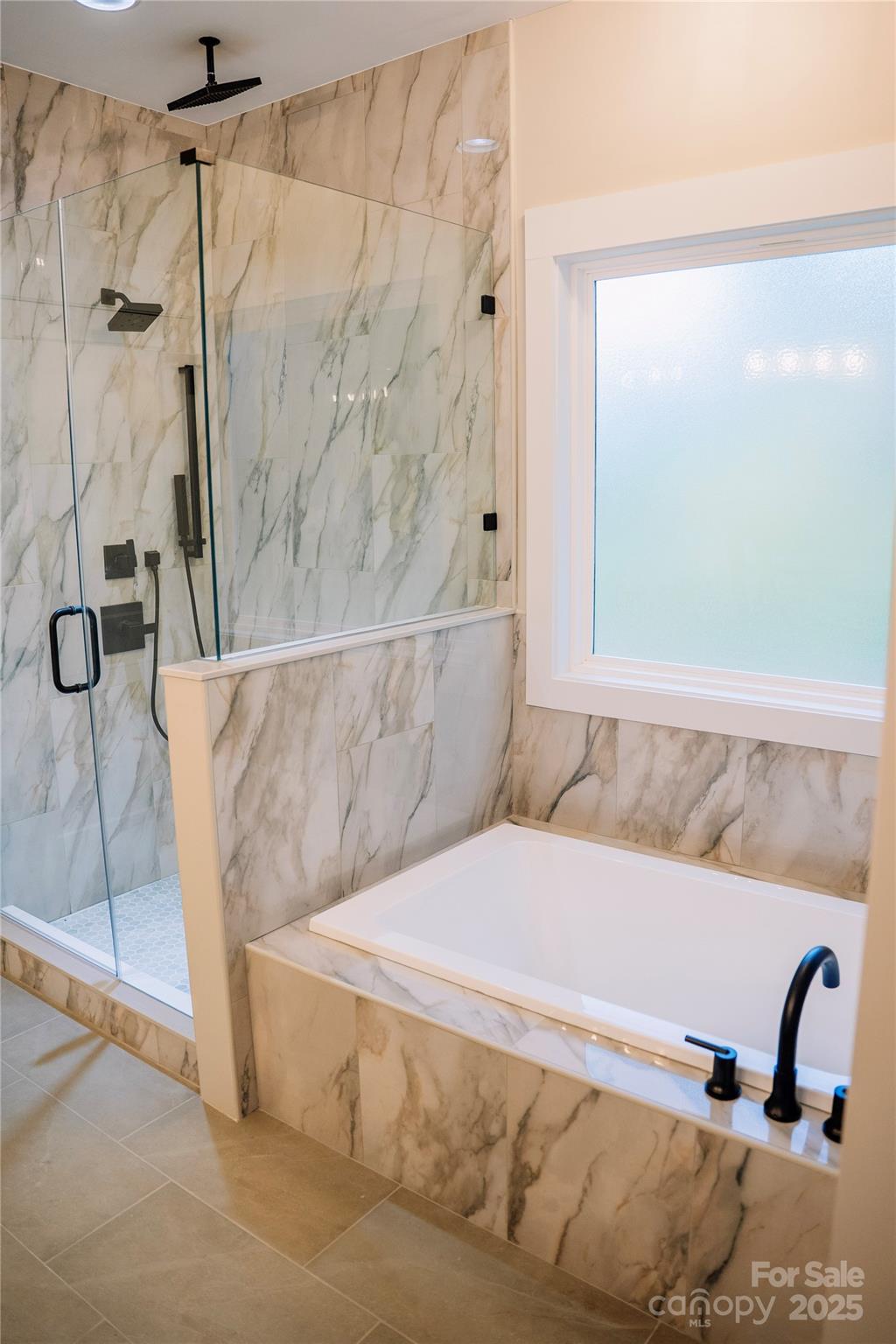 1004 East Sandy Ridge Road Monroe, NC 28112 - Photo 17 of 25 a bathroom with a tub and shower