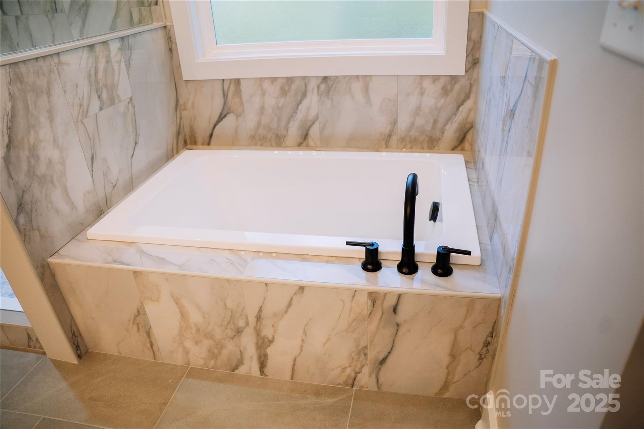 1004 East Sandy Ridge Road Monroe, NC 28112 - Photo 19 of 25 a bathroom with a sink and a window