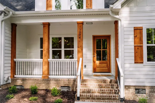 a front view of a house with a porch