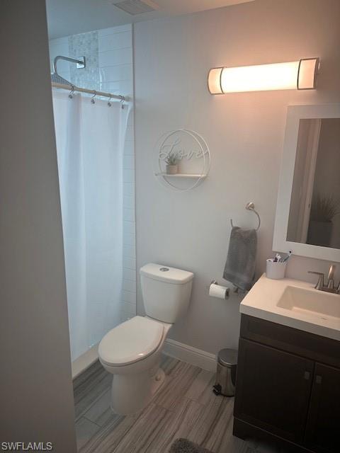 1205 Reserve Way, Unit 308 Naples, FL 34105 - Photo 11 of 21 a white toilet sitting next to a bathroom sink