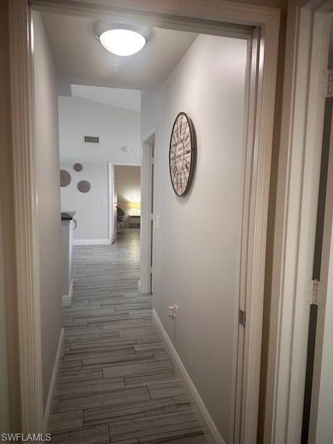 1205 Reserve Way, Unit 308 Naples, FL 34105 - Photo 12 of 21 a view of a hallway with wooden floor