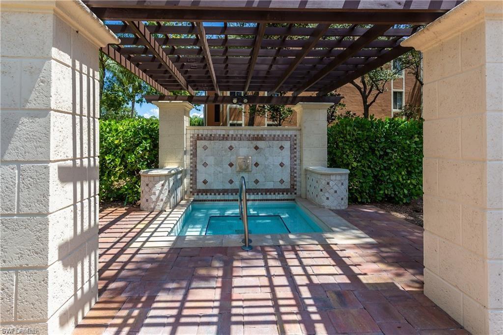 1205 Reserve Way, Unit 308 Naples, FL 34105 - Photo 18 of 21 a view of a backyard