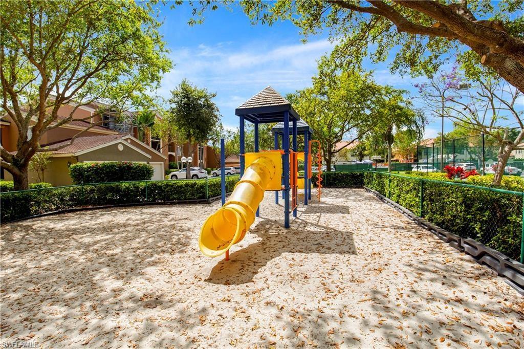 1205 Reserve Way, Unit 308 Naples, FL 34105 - Photo 20 of 21 a view of a park with a slide