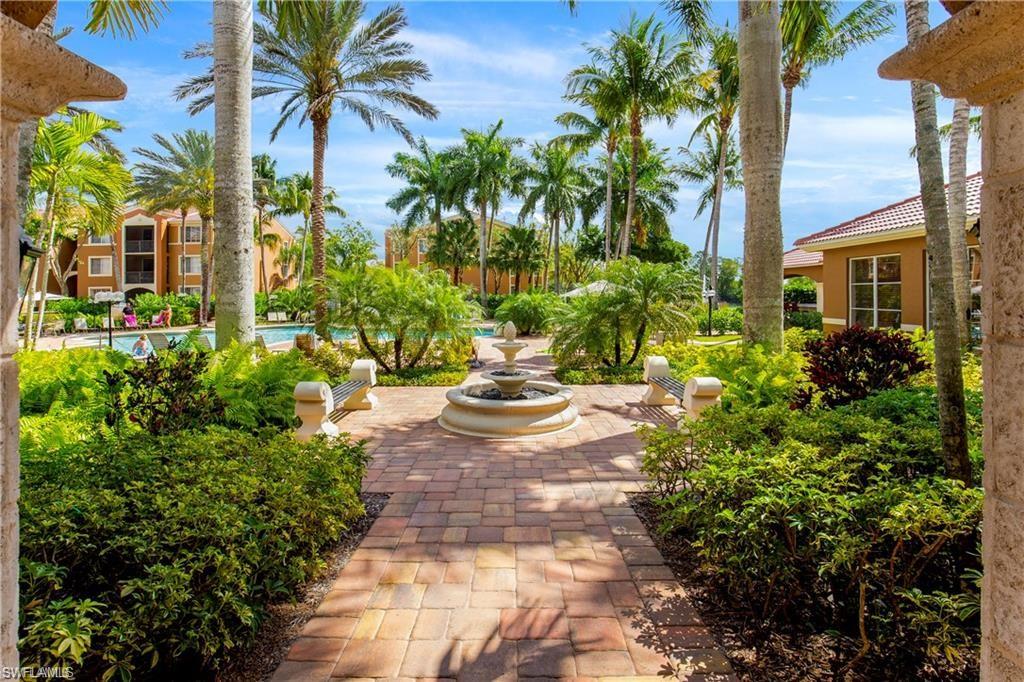 1205 Reserve Way, Unit 308 Naples, FL 34105 - Photo 21 of 21 a view of a yard with plants and palm trees
