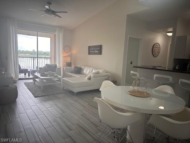 1205 Reserve Way, Unit 308 Naples, FL 34105 - Photo 4 of 21 a living room with furniture and a table