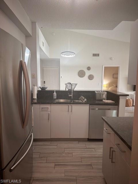 1205 Reserve Way, Unit 308 Naples, FL 34105 - Photo 6 of 21 a kitchen with stainless steel appliances granite countertop a refrigerator and a sink