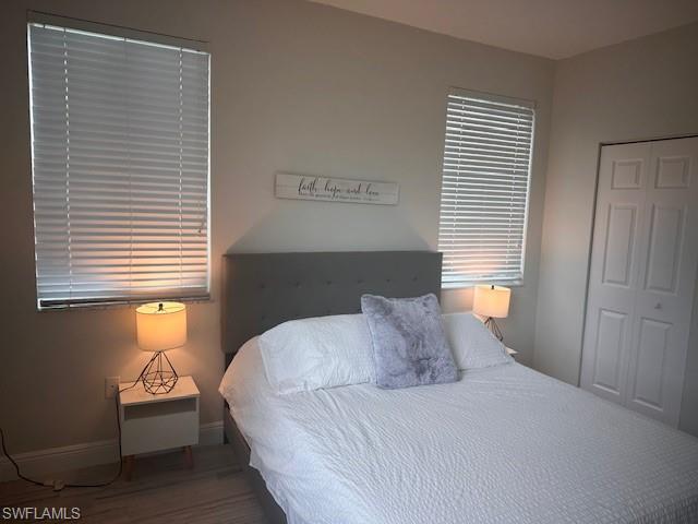 1205 Reserve Way, Unit 308 Naples, FL 34105 - Photo 9 of 21 a bedroom with a bed and a window