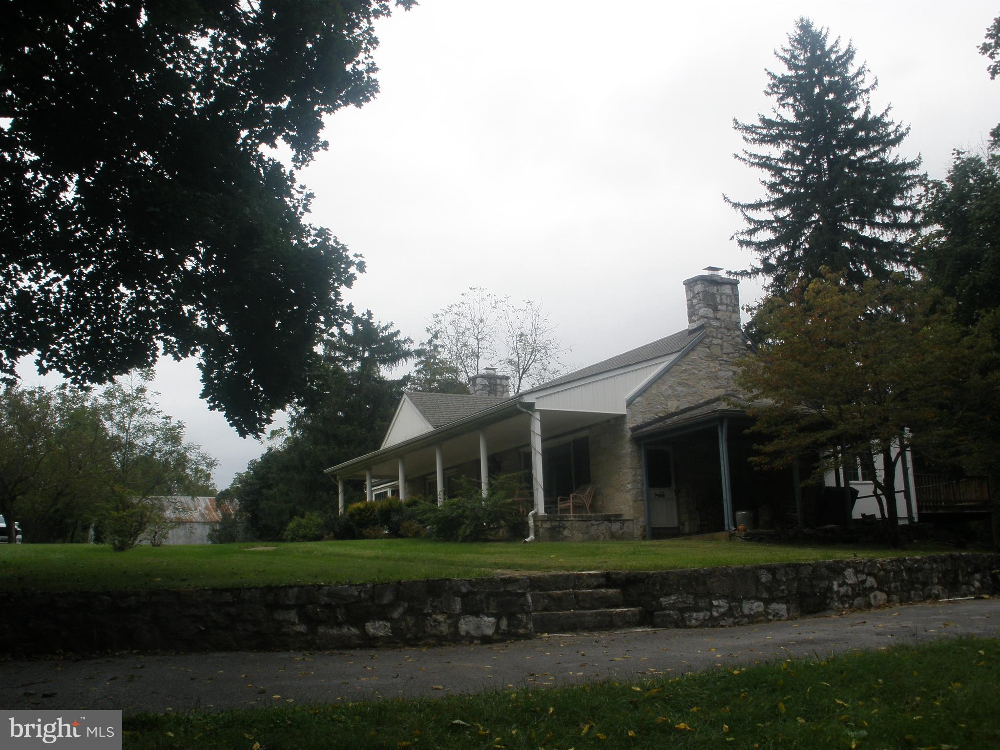 14103 Rockdale Road Clear Spring, MD 21722 - Photo 2 of 24 a front view of a house with a garden