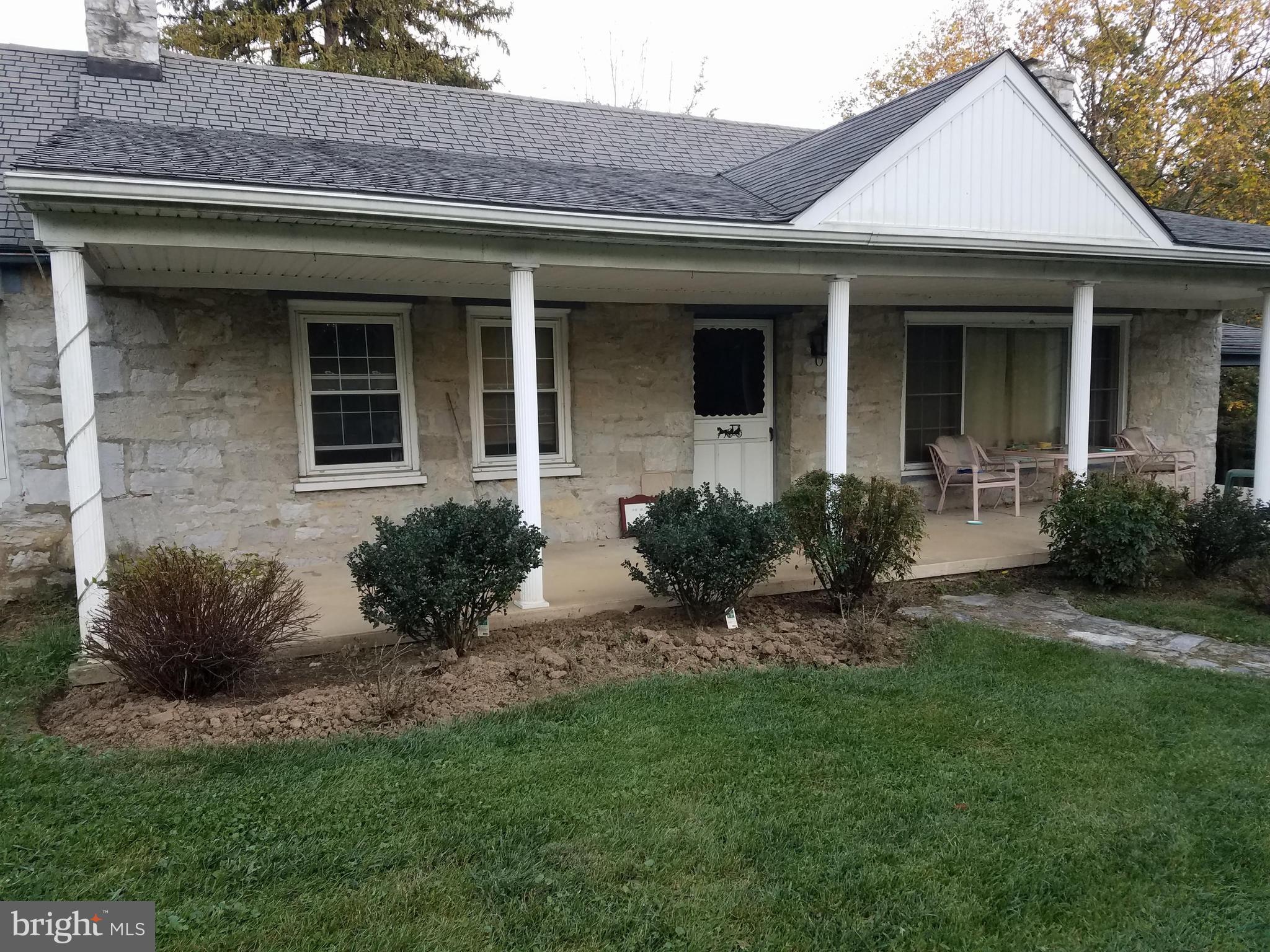 14103 Rockdale Road Clear Spring, MD 21722 - Photo 4 of 24 a front view of a house with a yard