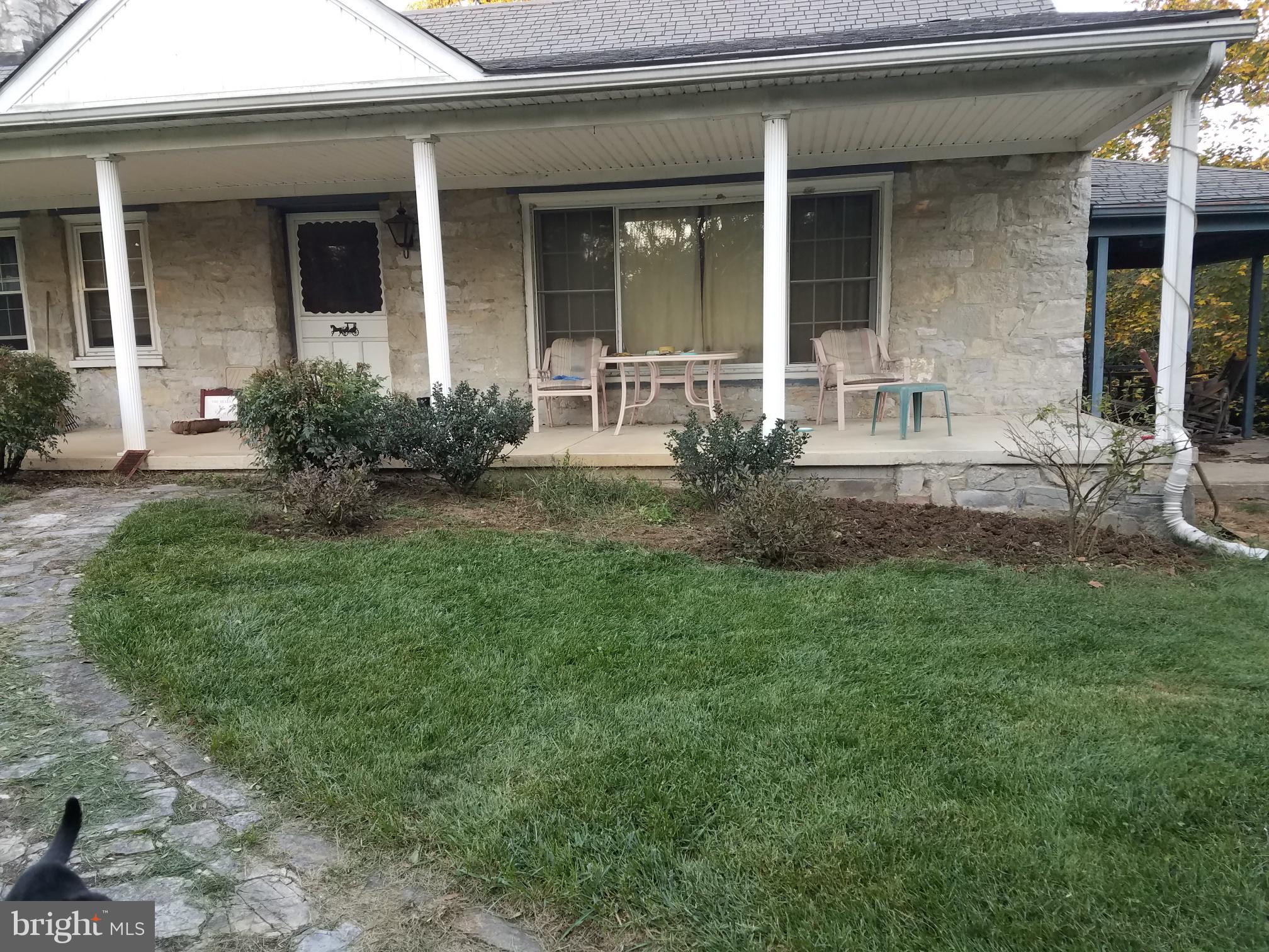 14103 Rockdale Road Clear Spring, MD 21722 - Photo 5 of 24 a front view of a house with garden
