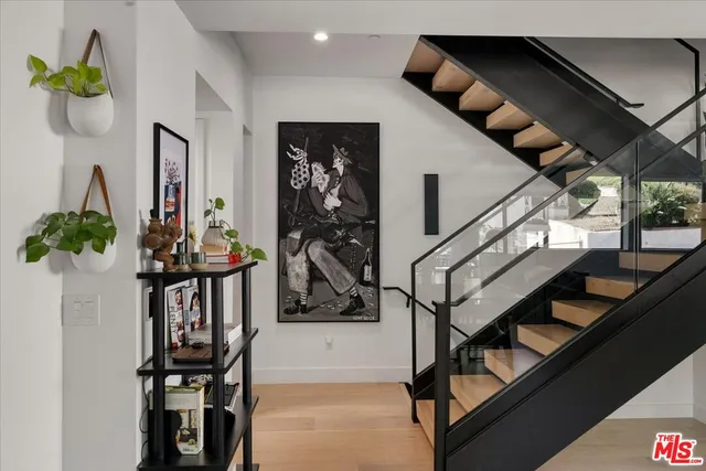 a view of entryway livingroom and hall