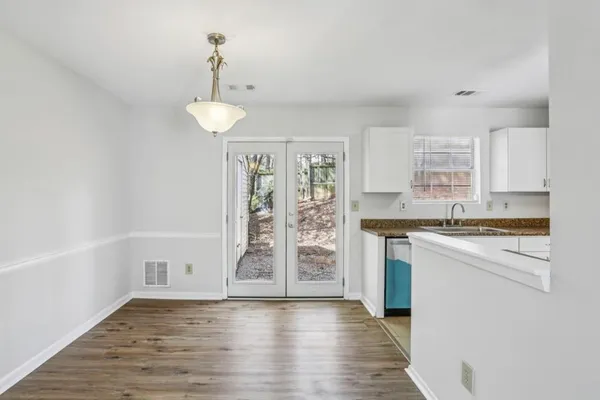a kitchen with granite countertop a stove and a refrigerator