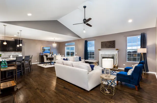 a living room with furniture fireplace and flat screen tv