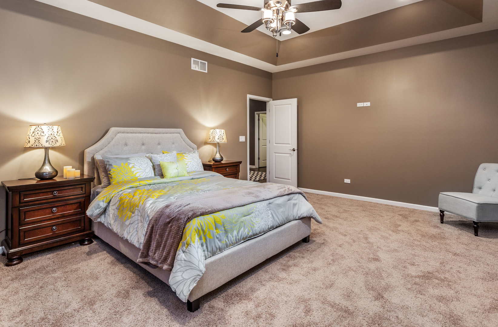 2831 Rood Street Yorkville, IL 60560 - Photo 14 of 17 a spacious bedroom with a bed and a chandelier