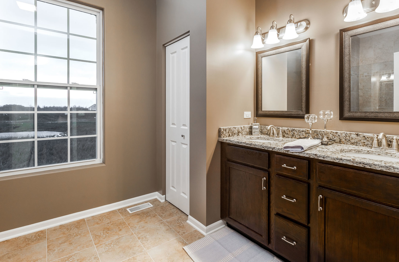 2831 Rood Street Yorkville, IL 60560 - Photo 15 of 17 a bathroom with a sink and a mirror