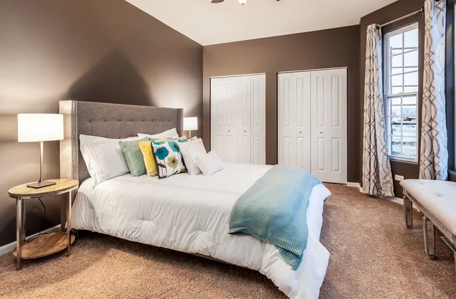 a bedroom with a bed and window