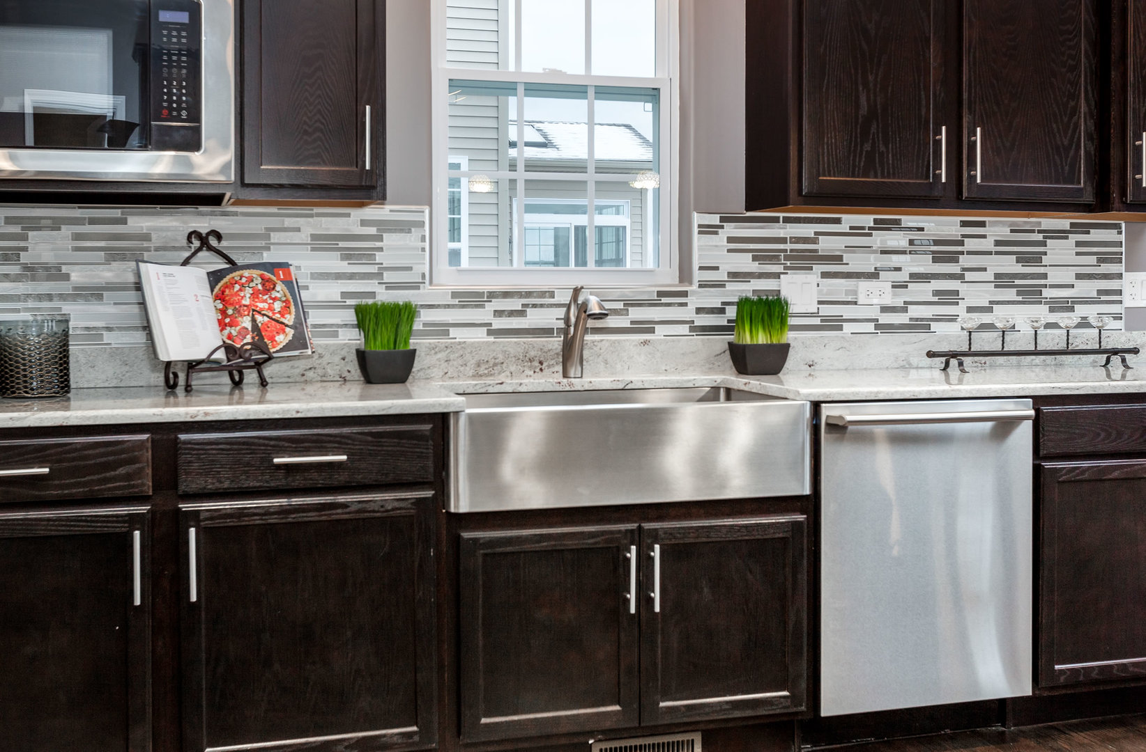 2831 Rood Street Yorkville, IL 60560 - Photo 6 of 17 a kitchen with stainless steel appliances granite countertop a sink stove and cabinets