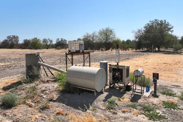 a view of a backyard with chairs