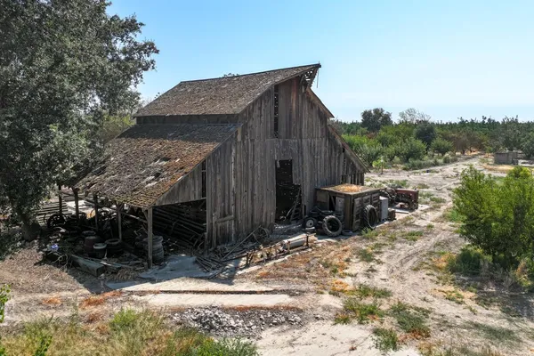 a view of a wooden house with a yard