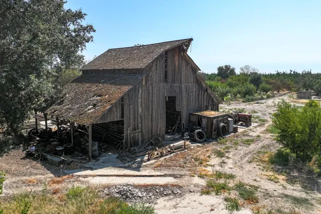 a view of a wooden house with a yard