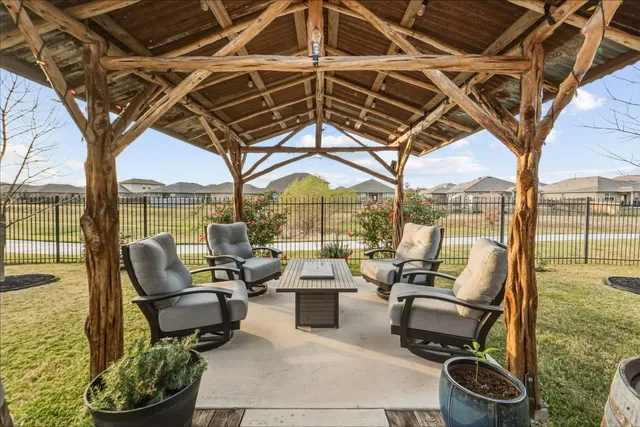 a building outdoor space with patio lots of furniture