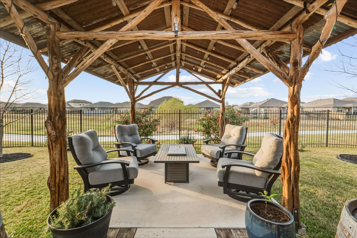 a building outdoor space with patio lots of furniture