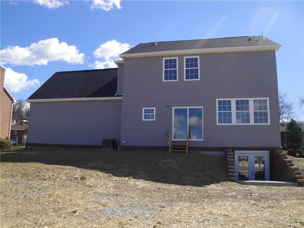 75 Windcrest Drive Cecil, PA 15321 - Photo 3 of 25 Rear view with sliding door from kitchen and walk out basement...