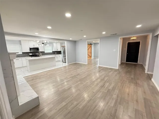 a view of kitchen with wooden floor