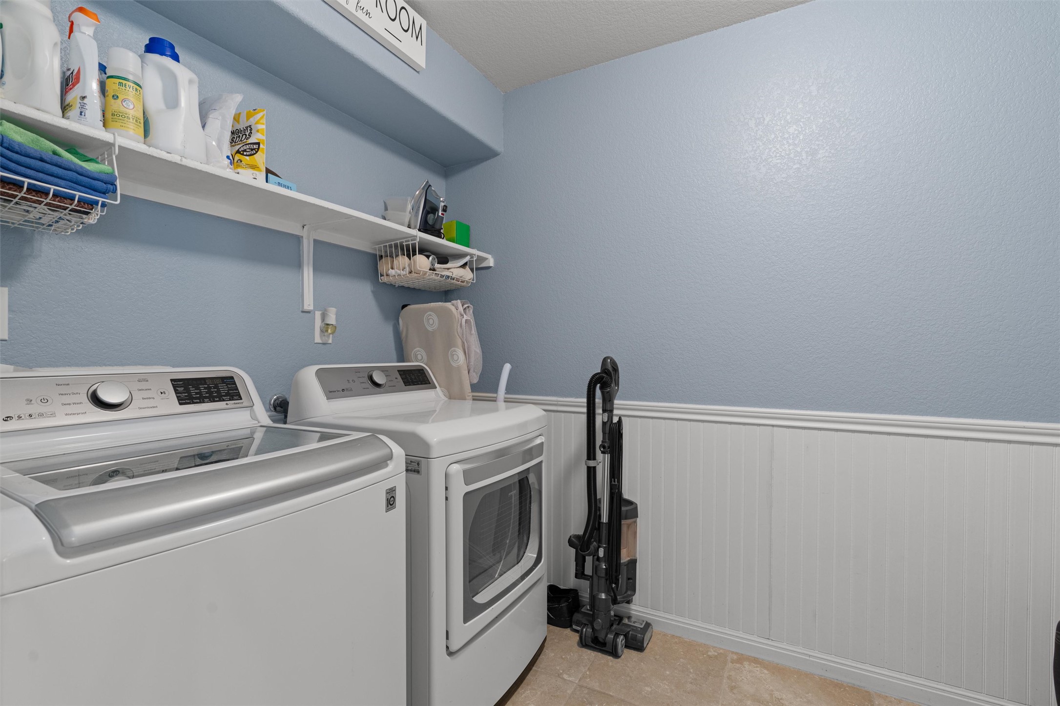 524 Longhorn Cavern Road Leander, TX 78641 - Photo 26 of 34 Laundry area featuring a wainscoted wall,