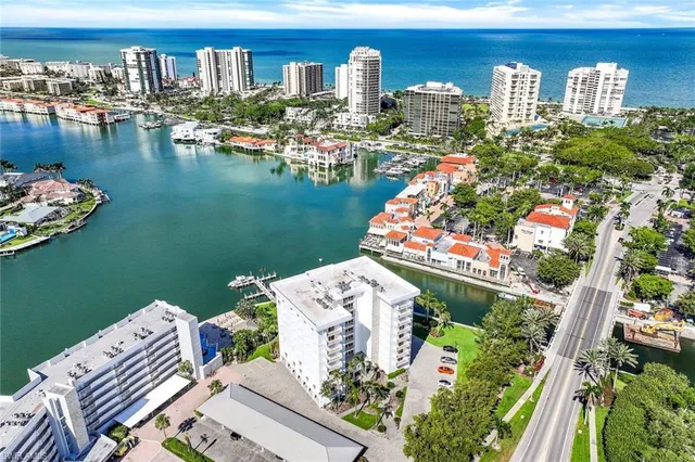 an aerial view of a house with a ocean view