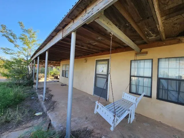 a view of patio with furniture