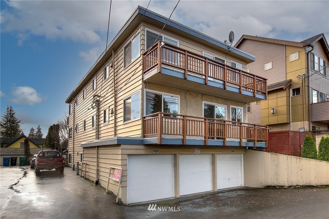 931 North 85th Street, Unit 5 Seattle, WA 98103 - Photo 1 of 11 a view of a white building among the street