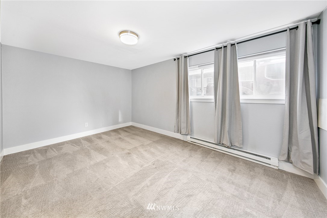931 North 85th Street, Unit 5 Seattle, WA 98103 - Photo 11 of 11 a view of an empty room with a window