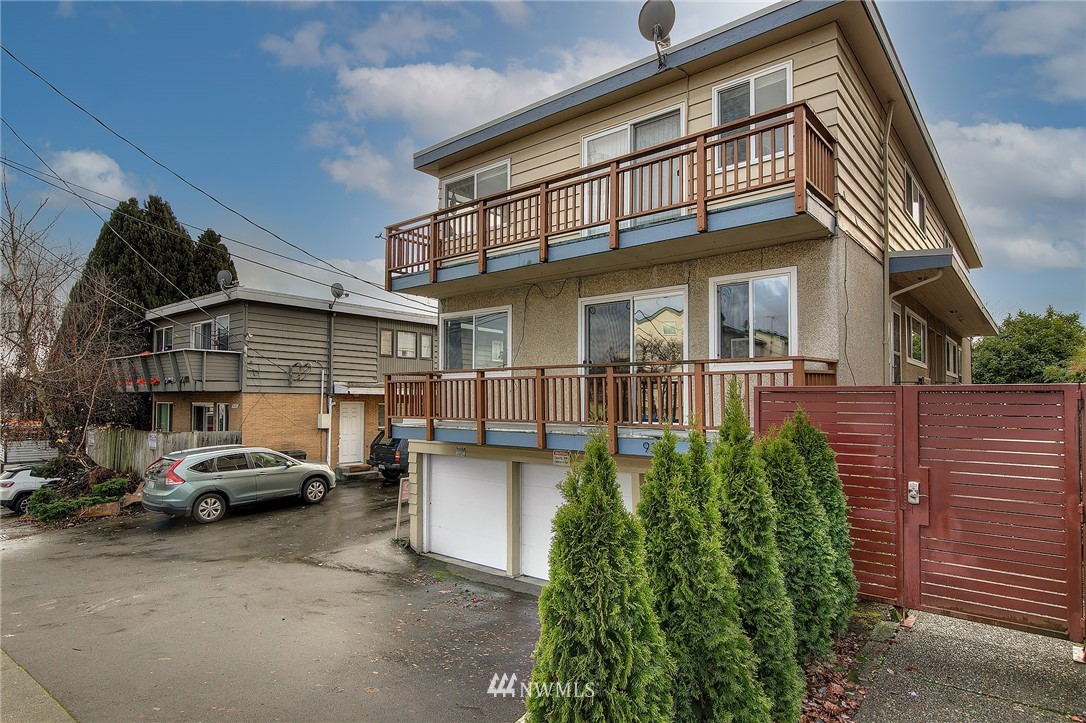 931 North 85th Street, Unit 5 Seattle, WA 98103 - Photo 2 of 11 a view of a car park in front of house