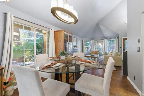 a view of a dining room with furniture and wooden floor