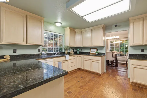 a spacious bedroom with a bed and a large window