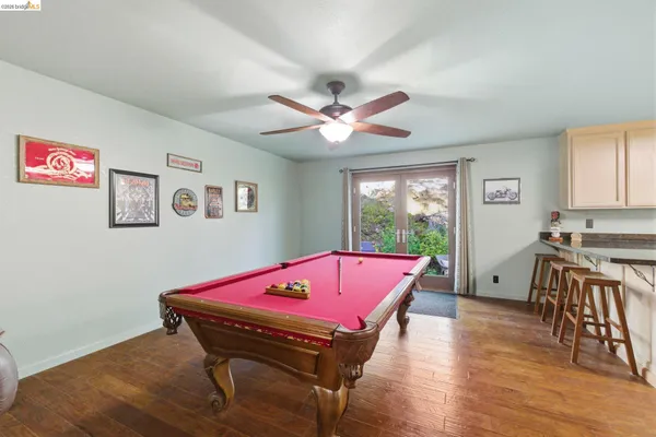 a bedroom with a bed and a desk