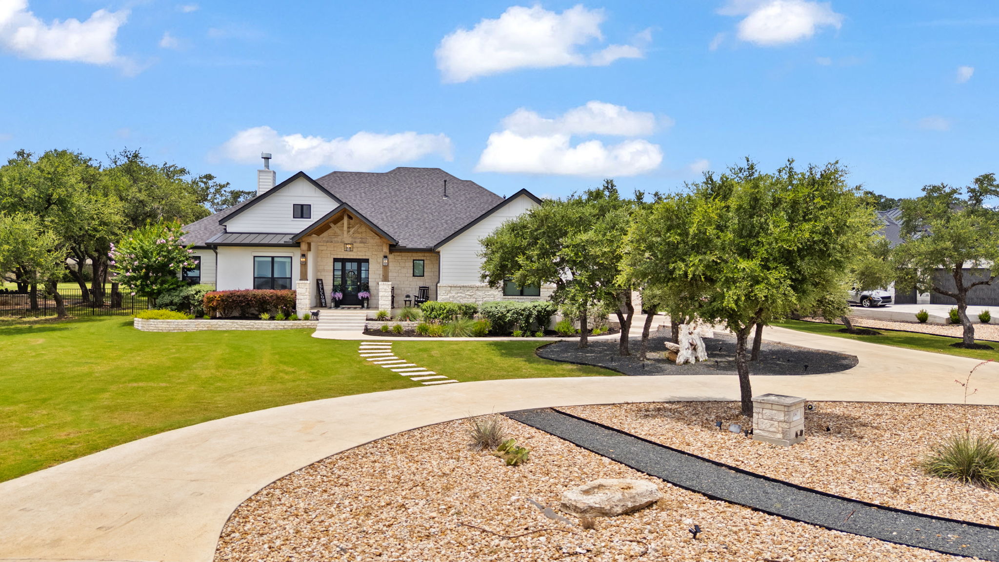 104 Lower Cedar Cove Georgetown, TX 78633 - Photo 1 of 37 a front view of a house with garden