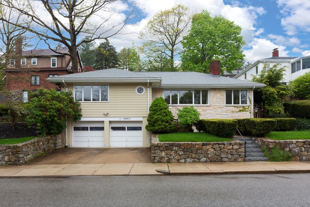 39 Cedarwood Road Boston, MA 02130 - Photo 1 of 11 a front view of a house with a garden