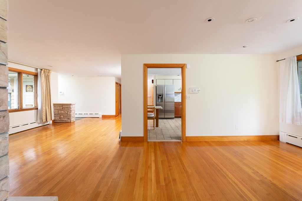 39 Cedarwood Road Boston, MA 02130 - Photo 5 of 11 a view of a room with wooden floor and a window