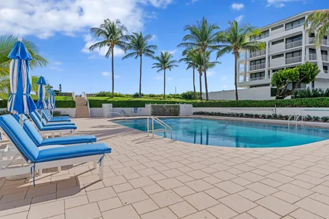 a view of a swimming pool with a patio