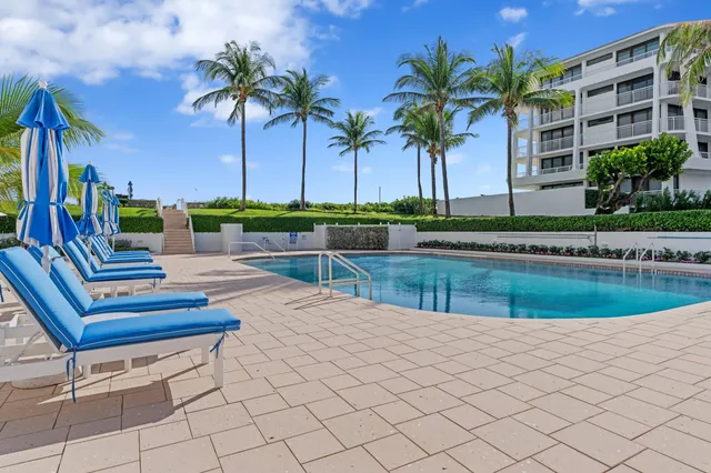 a view of a swimming pool with a patio