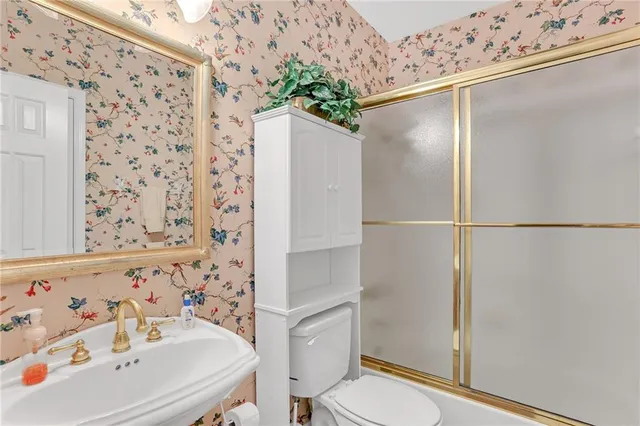 a outdoor living room with furniture and a floor to ceiling window