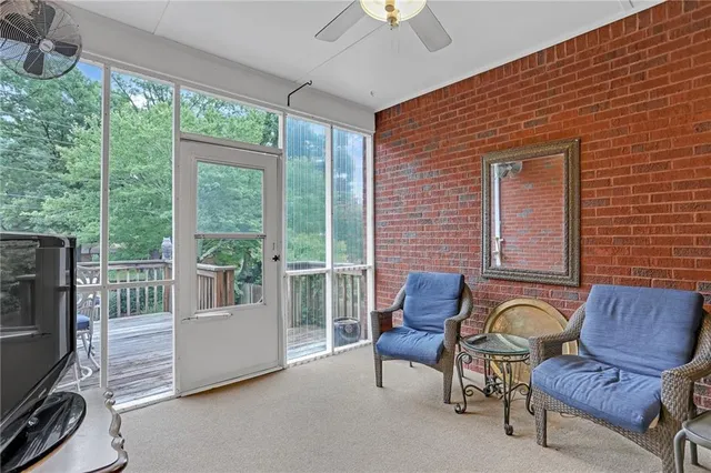 a view of a chairs and table in the balcony
