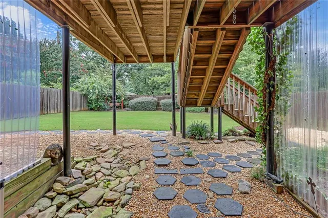 a view of a house with a small deck