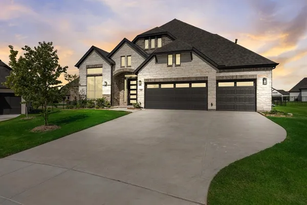 a front view of a house with yard